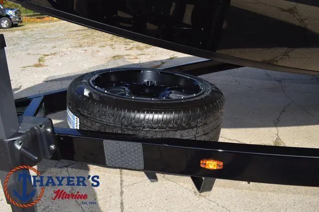 Slide: The Image of 2025 Ikon Boats VLX20 trailer with spare tire at Thayer's Marine. - 6