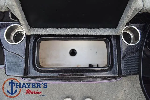 Slide: The Image of 2011 Nitro Z Series Z-6 boat storage compartment with cup holders, Thayer's Marine logo. - 10