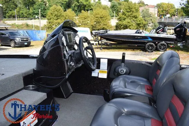 Slide: The Image of 2011 Nitro Z Series Z-6 boat interior with steering wheel and seats at Thayer's Marine. - 16