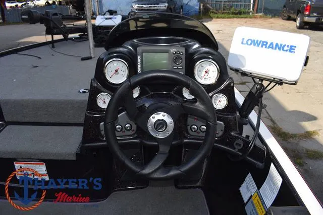 Slide: The Image of 2011 Nitro Z Series Z-6 boat dashboard with Lowrance electronics and steering wheel. - 17