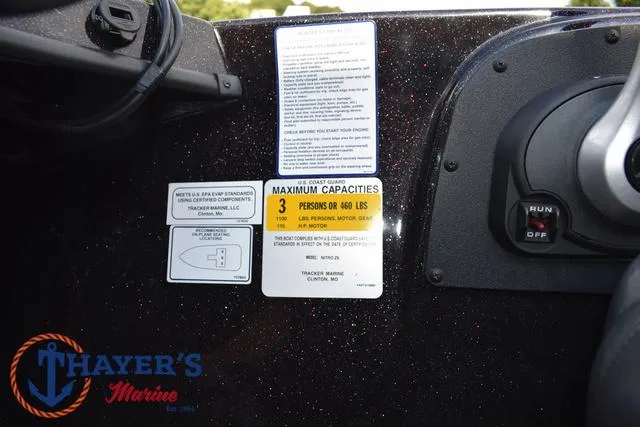 Slide: The Image of 2011 Nitro Z Series Z-6 boat dashboard with capacity and safety labels. - 18