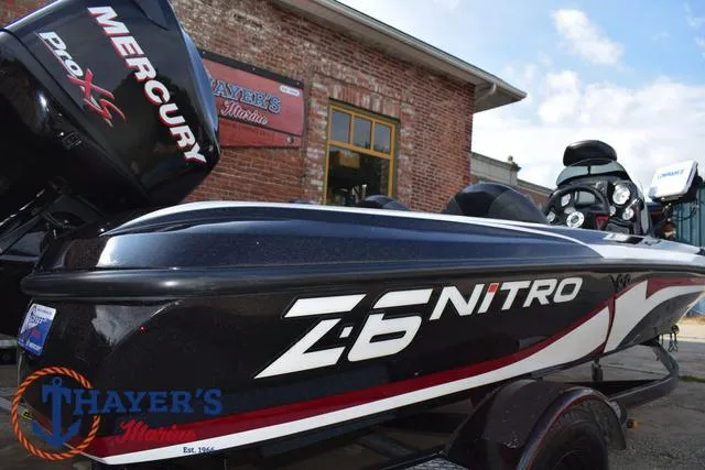 Slide: The Image of 2011 Nitro Z Series Z-6 boat with Mercury Pro XS engine, parked outside Thayer's Marine. - 25