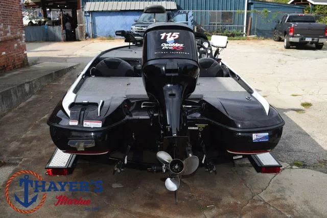 Slide: The Image of 2011 Nitro Z Series Z-6 boat with 115 horsepower engine, parked outdoors. - 39