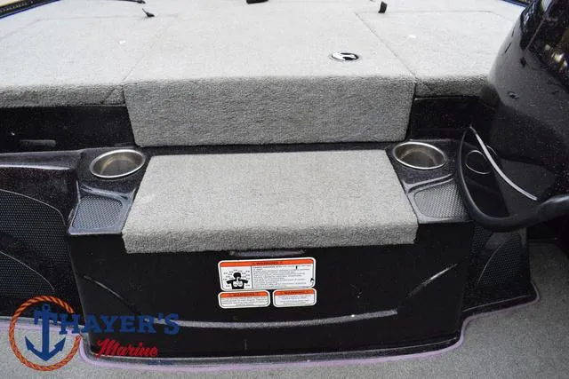 Slide: The Image of 2011 Nitro Z Series Z-6 boat interior with cup holders and carpeted seating. - 9