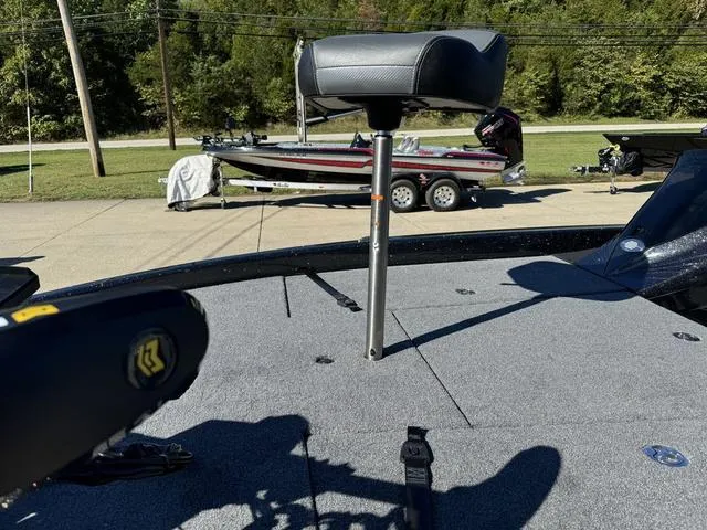 Slide: The Image of 2025 Phoenix 819 ZXL boat with elevated seat, parked on a sunny day. - 11