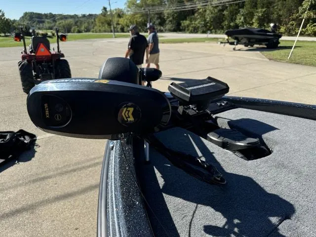 Slide: The Image of 2025 Phoenix 819 ZXL boat with trolling motor in parking lot. - 12