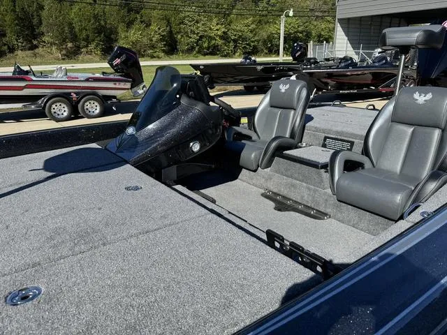 Slide: The Image of 2025 Phoenix 819 ZXL boat interior with sleek seating and modern dashboard. - 13