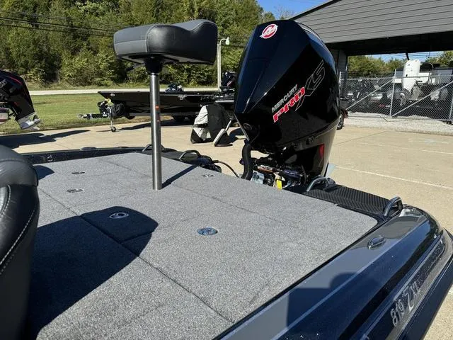 Slide: The Image of Phoenix 819 ZXL 2025 boat with powerful engine and seating, parked outdoors. - 15