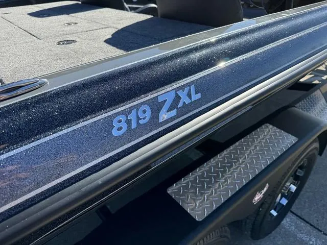 Slide: The Image of 2025 Phoenix 819 ZXL boat with sleek design and metallic finish. - 6