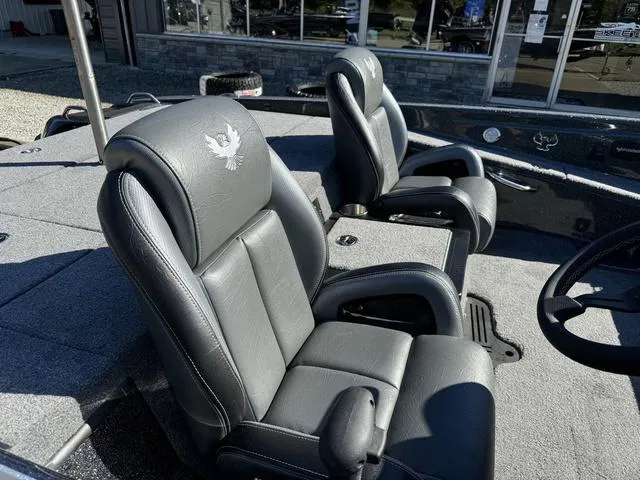Slide: The Image of 2025 Phoenix 819 ZXL boat interior with two gray leather seats. - 7