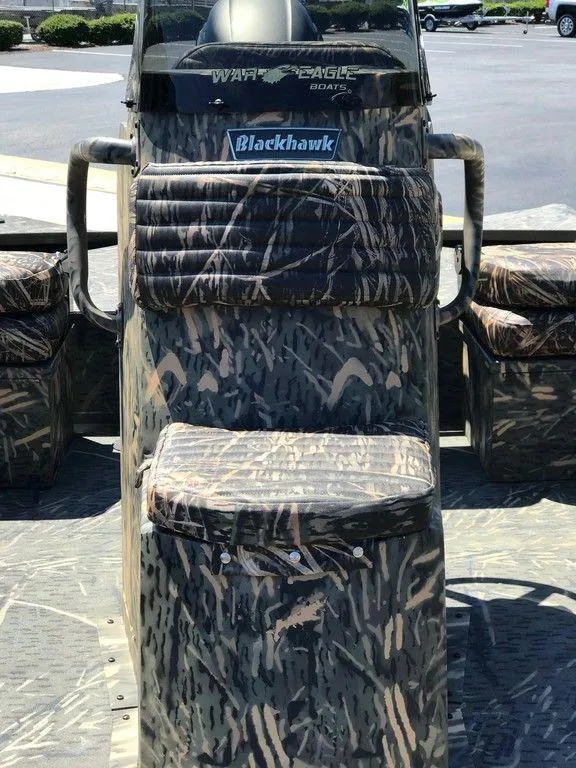 Slide: The Image of 2025 War Eagle Blackhawk 961 boat with camouflage seating and console. - 10
