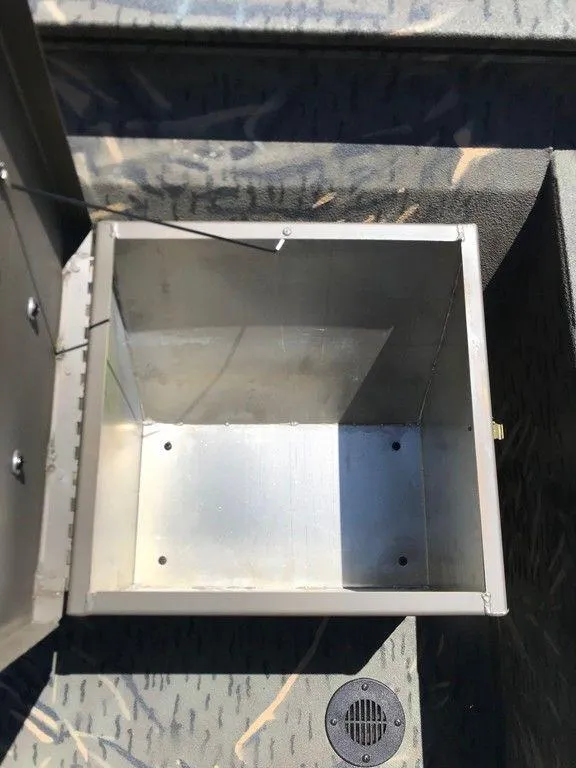 Slide: The Image of Open storage compartment in 2025 War Eagle Blackhawk 961 boat. - 5