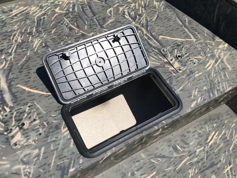 Slide: The Image of War Eagle Blackhawk 961 storage compartment, 2025 model, open lid on camo surface. - 7