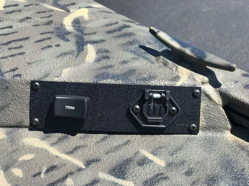 Slide: The Image of Control panel on War Eagle Blackhawk 961 boat, featuring trim switch, 2025 model. - 8