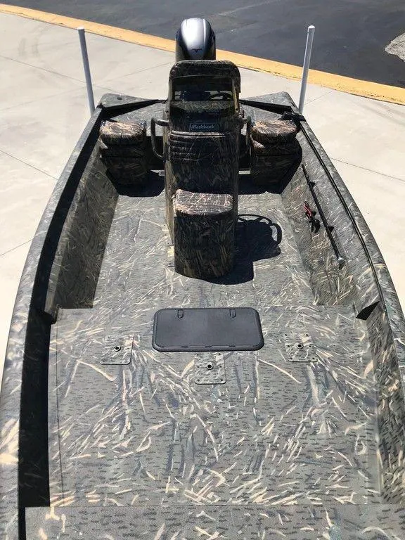 Slide: The Image of 2025 War Eagle Blackhawk 961 boat with camouflage design on a concrete surface. - 9