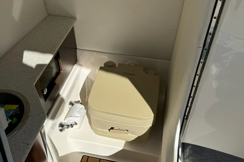 Slide: The Image of Portable toilet in 2018 Regal 26 FasDeck boat interior. - 11