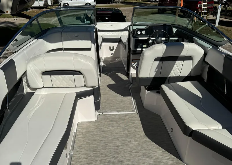 Slide: The Image of 2018 Regal 26 FasDeck boat interior with white seating and modern dashboard. - 5