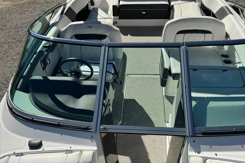 Slide: The Image of 2018 Regal 26 FasDeck boat interior with seating and steering wheel, viewed from above. - 8