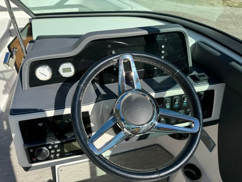Slide: The Image of Steering wheel and dashboard of 2018 Regal 26 FasDeck boat. - 9