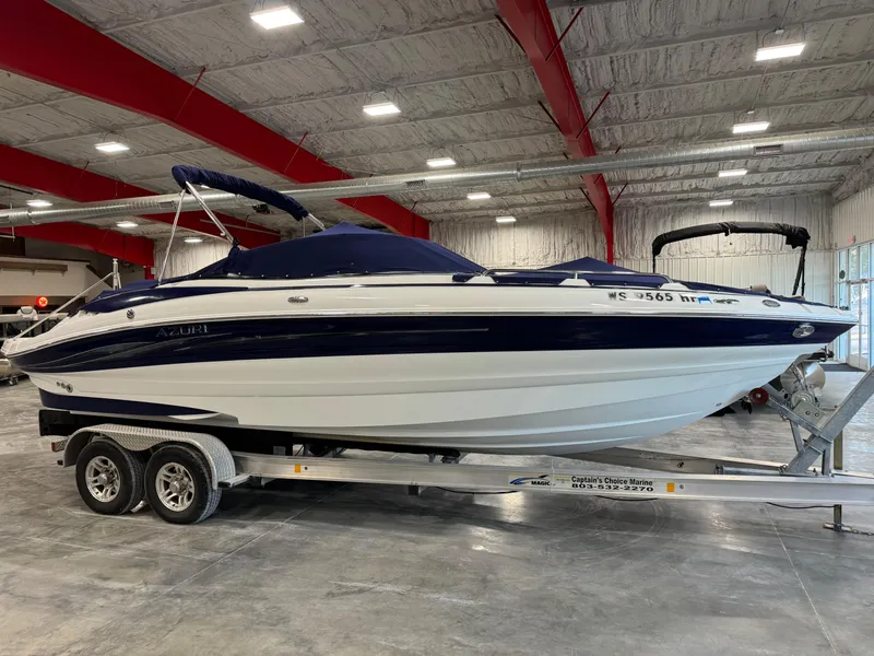 Slide: The Image of 2008 Azure 278 boat on trailer in indoor storage facility. - 13
