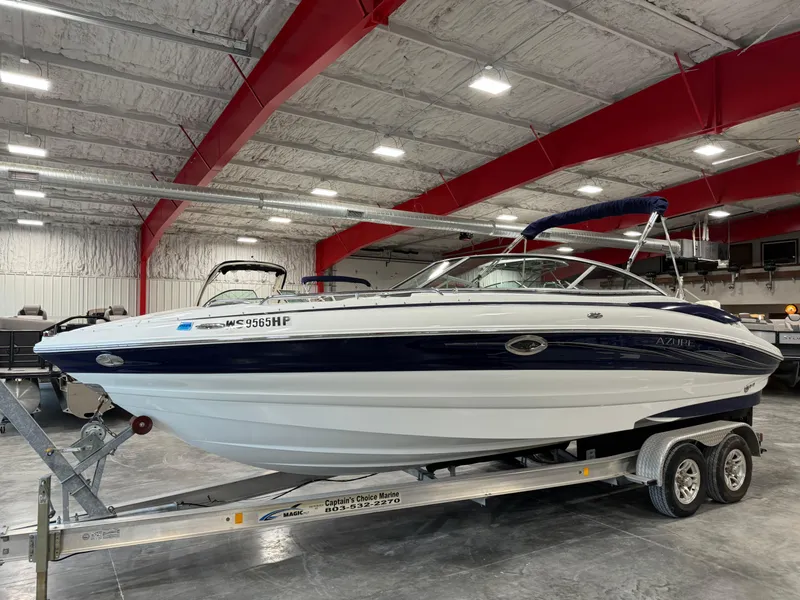 Slide: The Image of 2008 Azure 278 boat on trailer in indoor storage facility. - 2