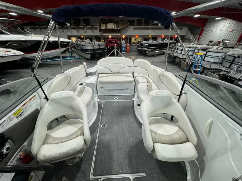 Slide: The Image of Interior of a 2008 Azure 278 boat with white seating in a showroom. - 7