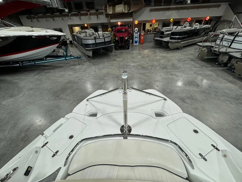 Slide: The Image of 2008 Azure 278 boat in showroom with various other boats on display. - 8