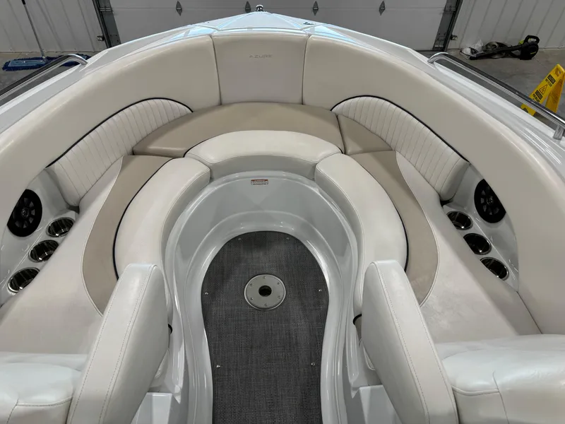 Slide: The Image of 2008 Azure 278 boat interior with white leather seating and cup holders. - 9