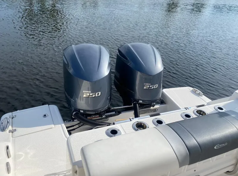Slide: The Image of 2021 Robalo R272 Center Console with twin Yamaha 250 engines on water. - 13