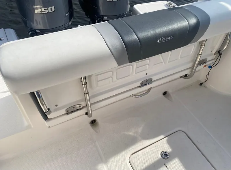 Slide: The Image of 2021 Robalo R272 Center Console boat interior with dual Yamaha 250 engines. - 15