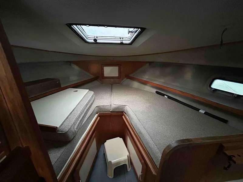 Slide: The Image of Interior cabin of 1986 Silverton 31 Convertible boat with skylight and seating. - 15