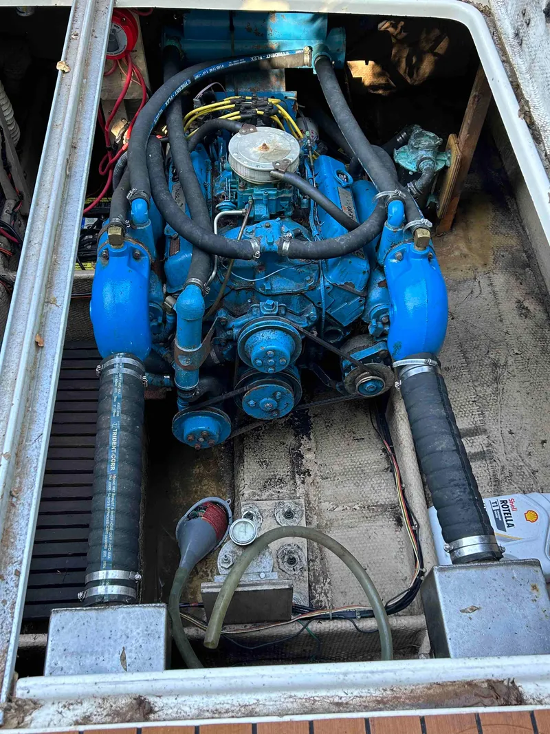 Slide: The Image of 1986 Silverton 31 Convertible engine compartment with visible blue engine components. - 21