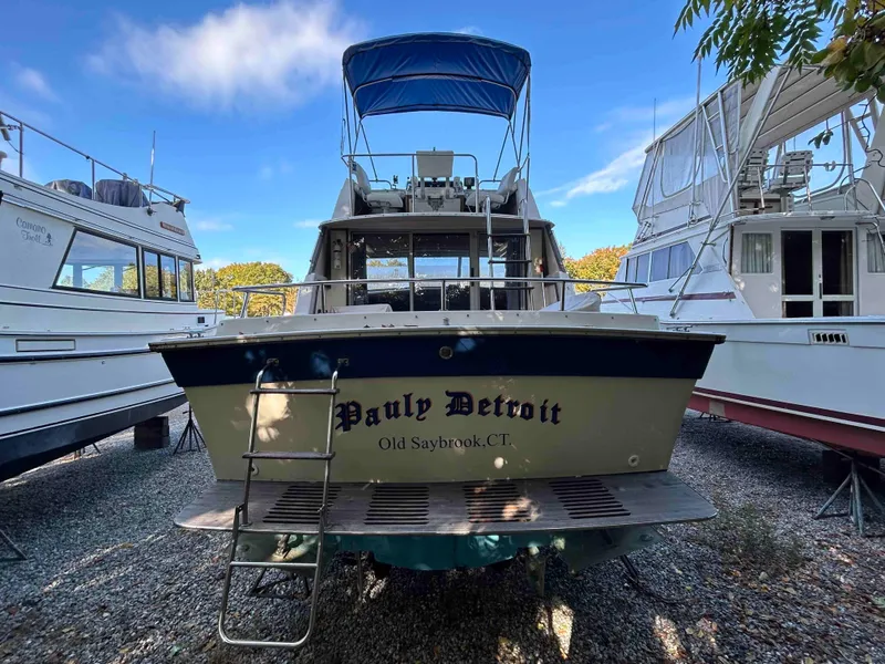 Slide: The Image of 1986 Silverton 31 Convertible boat docked, featuring "Pauly Detroit" name, Old Saybrook, CT. - 3