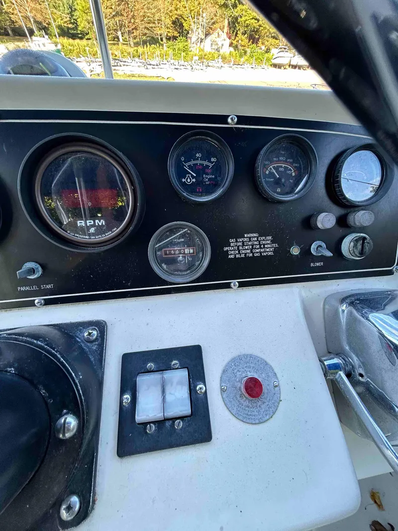 Slide: The Image of Dashboard of a 1986 Silverton 31 Convertible boat with gauges and controls. - 5