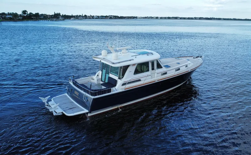 Slide: The Image of 2013 Sabre 48 Salon Express yacht cruising on calm waters. - 2