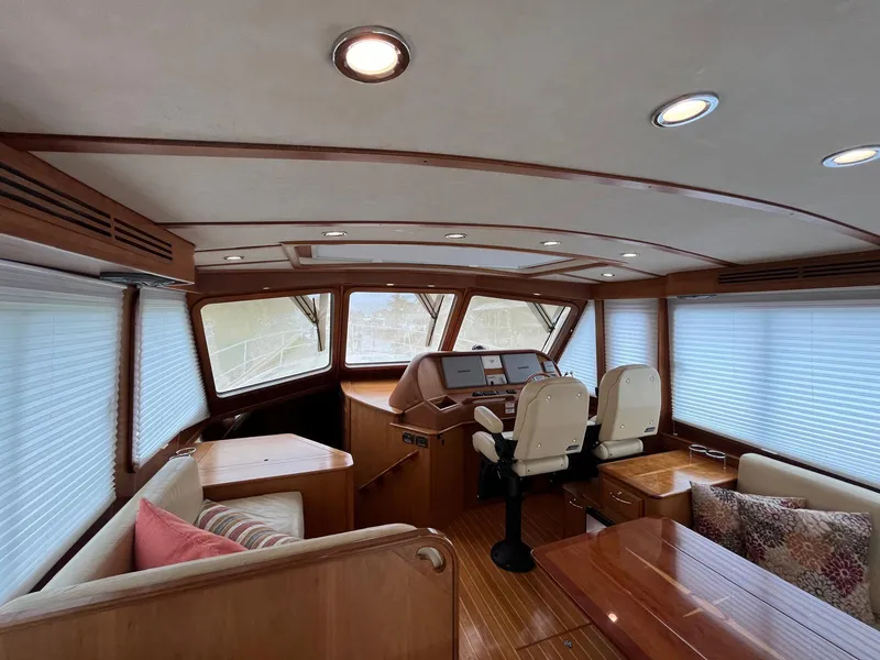 Slide: The Image of Interior of 2013 Sabre 48 Salon Express yacht with wood finish and seating area. - 22