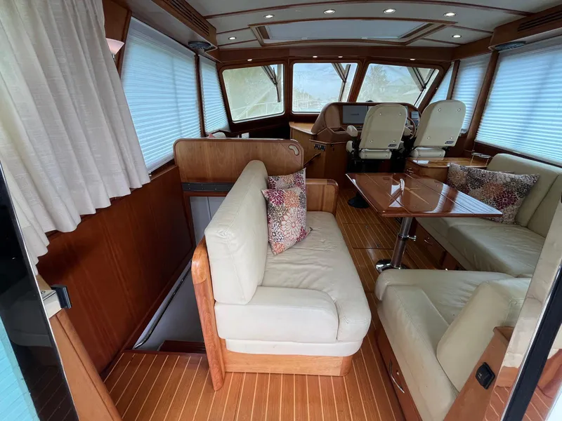 Slide: The Image of Interior of 2013 Sabre 48 Salon Express yacht with elegant seating and wooden finishes. - 24