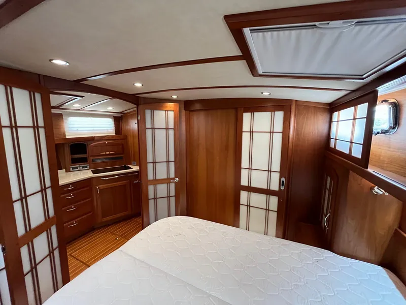 Slide: The Image of Luxurious interior of 2013 Sabre 48 Salon Express yacht with wood paneling and modern amenities. - 25