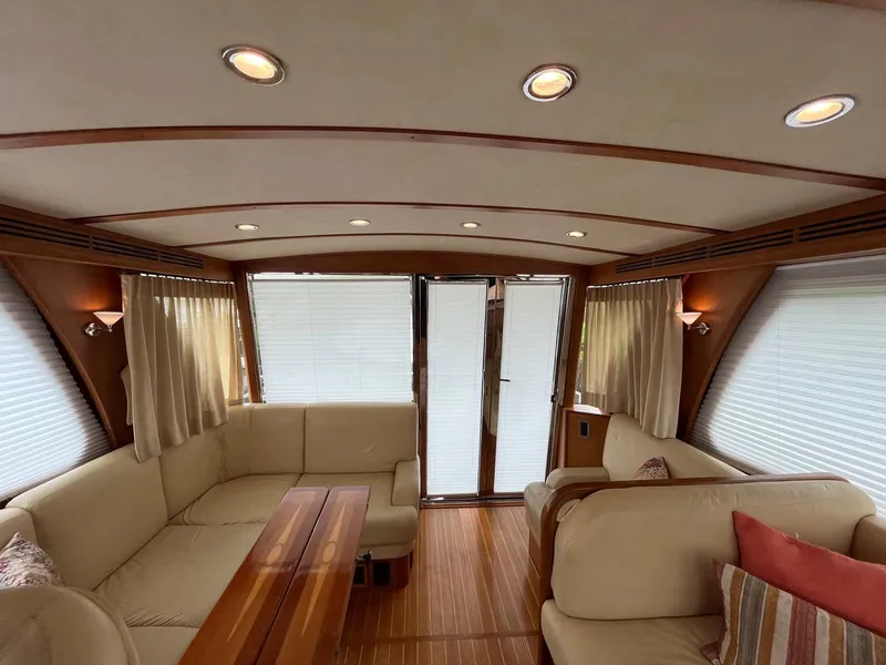 Slide: The Image of Interior of 2013 Sabre 48 Salon Express yacht with elegant seating and wood accents. - 26