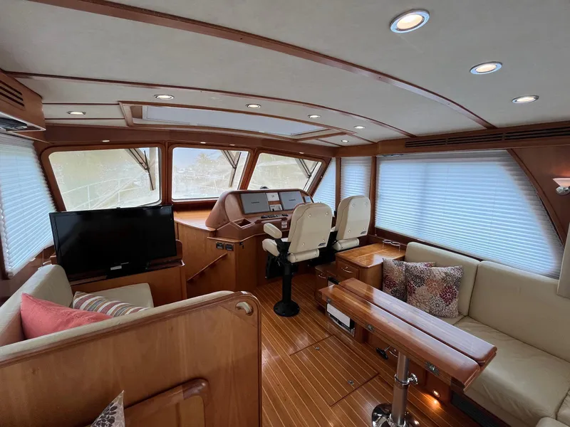 Slide: The Image of Luxurious interior of 2013 Sabre 48 Salon Express yacht with wood finish and seating. - 28