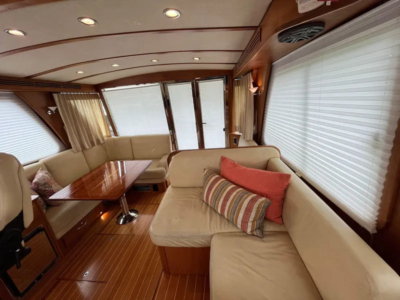Slide: The Image of Interior of 2013 Sabre 48 Salon Express with elegant seating and wooden accents. - 31