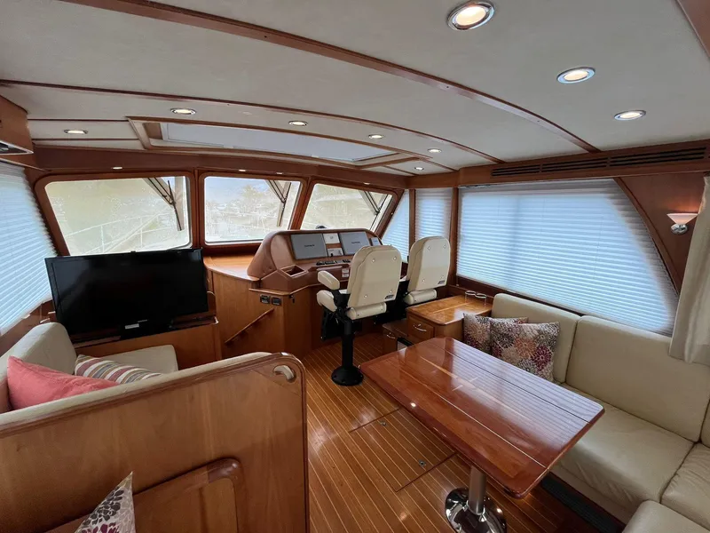 Slide: The Image of Interior of 2013 Sabre 48 Salon Express yacht with elegant wood finish and seating area. - 32