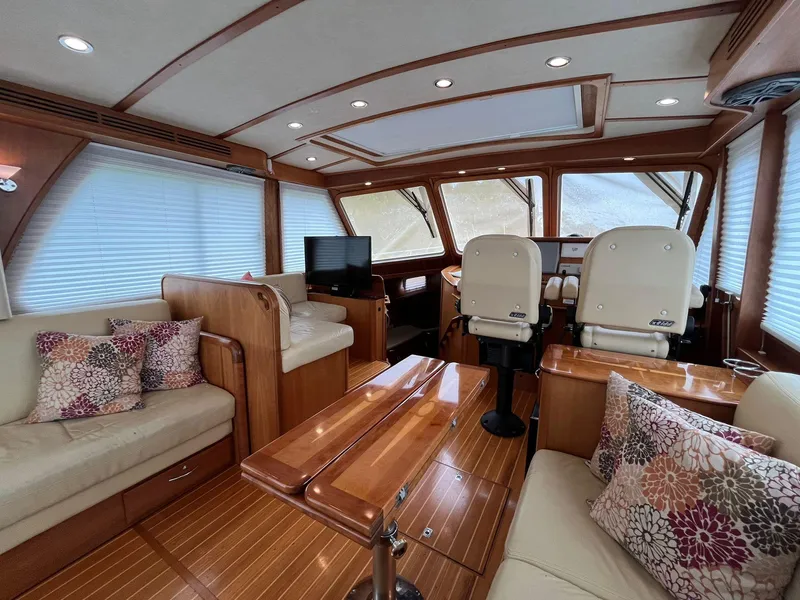 Slide: The Image of Luxurious interior of 2013 Sabre 48 Salon Express yacht with plush seating and wood finishes. - 38