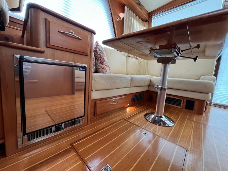 Slide: The Image of Interior of 2013 Sabre 48 Salon Express with wood flooring and seating area. - 45