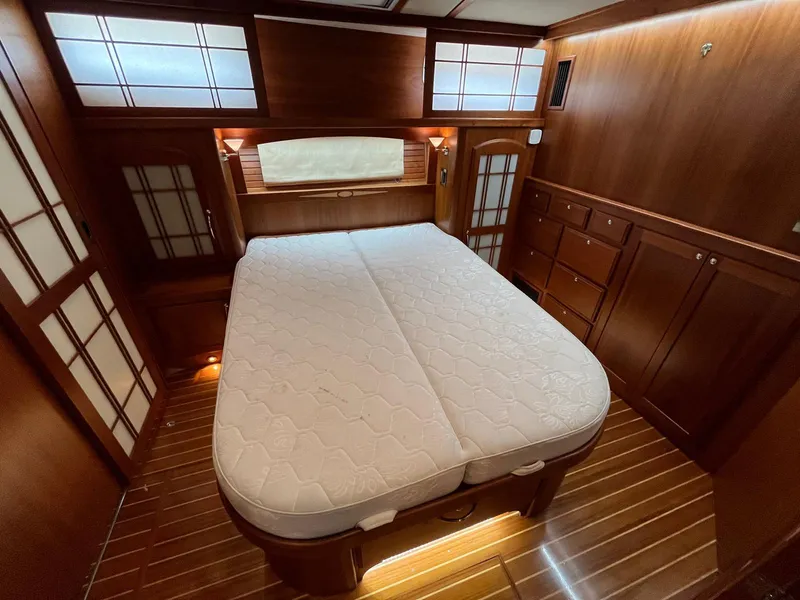 Slide: The Image of Luxurious 2013 Sabre 48 Salon Express cabin with elegant wood finish and comfortable bed. - 47