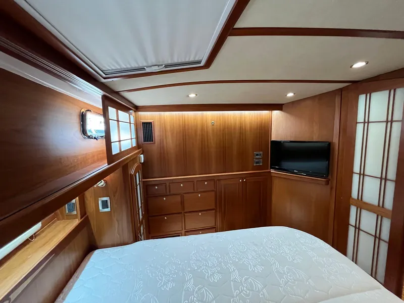 Slide: The Image of Luxurious wood-paneled cabin interior of 2013 Sabre 48 Salon Express yacht. - 49