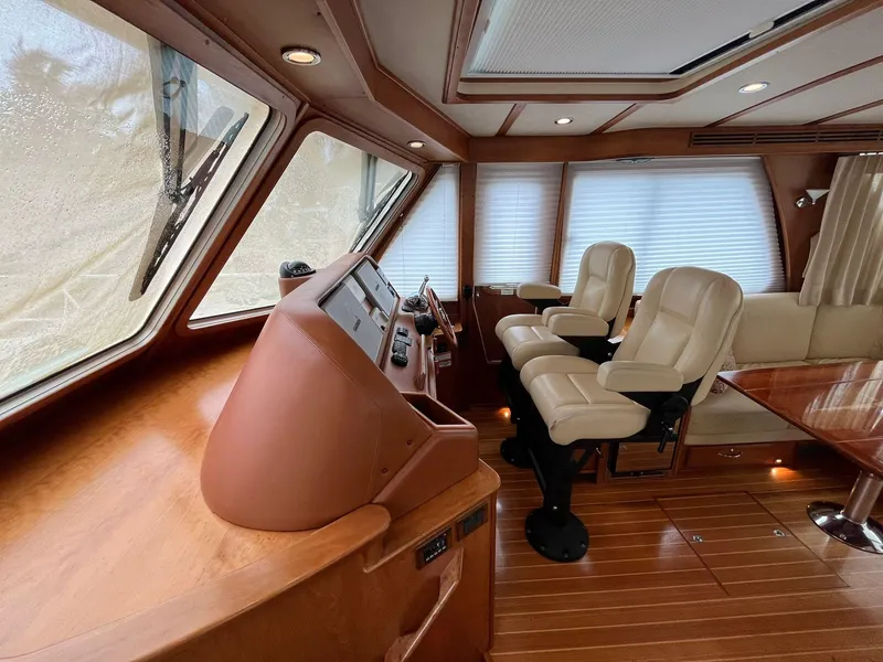 Slide: The Image of Interior of 2013 Sabre 48 Salon Express yacht with leather seats and wooden finishes. - 9