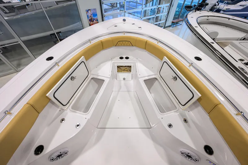 Slide: The Image of 2025 Sportsman Open 282 Center Console boat interior with storage compartments open. - 10