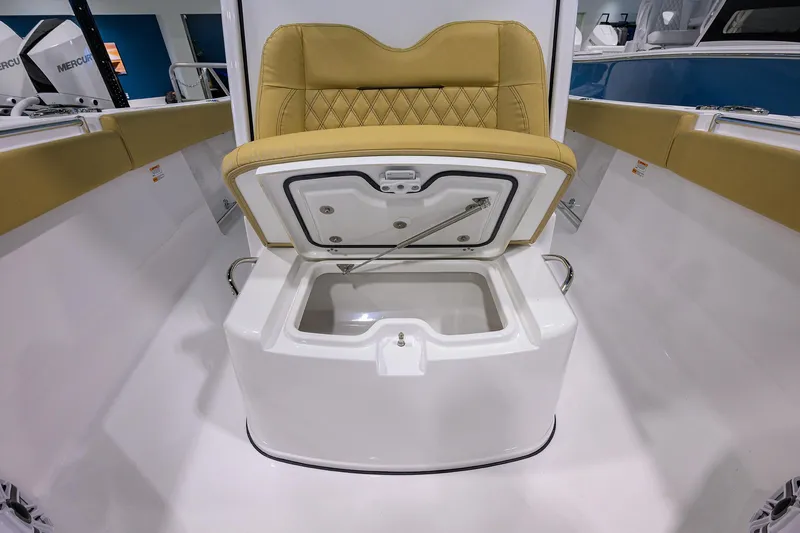 Slide: The Image of 2025 Sportsman Open 282 Center Console boat with open storage compartment and cushioned seating. - 11