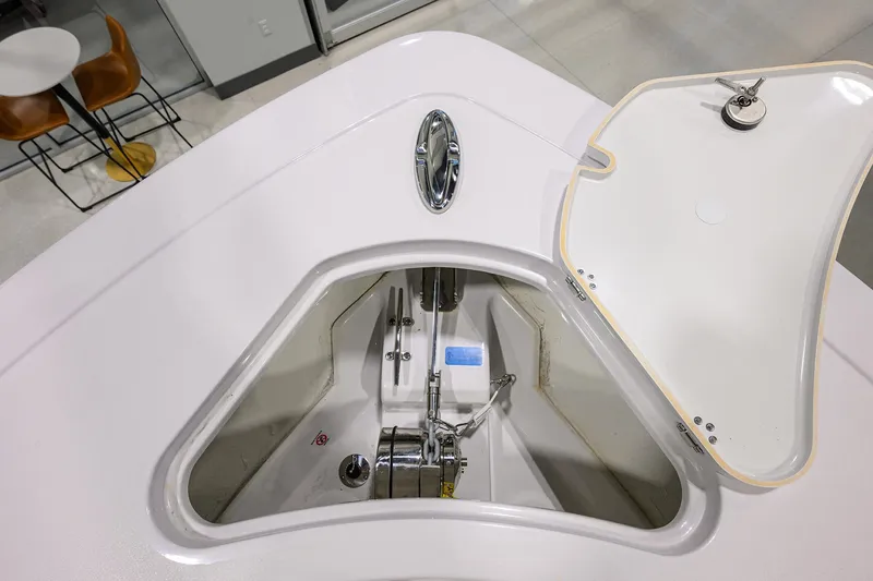 Slide: The Image of 2025 Sportsman Open 282 Center Console anchor compartment, open lid, modern design. - 12